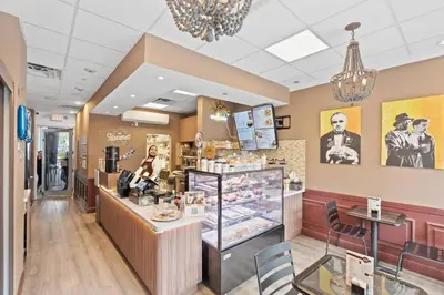 a restaurant with a pastry counter in a store at SUNNY ISLES 4BR Pool & Beach Access in Sunny Isles Beach