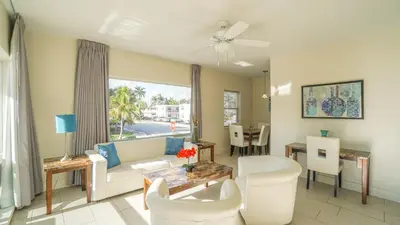 a living room with a couch and a table at Soleado Hotel in Fort Lauderdale
