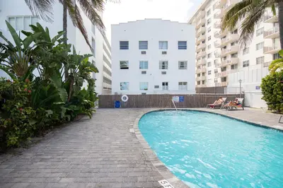 a swimming pool in the middle of a building at So South Beach in Miami Beach