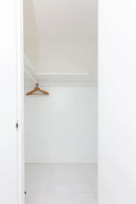 a white room with a white door and a hanger at UNIT #908 Castle Beach Club Condominium in Miami Beach