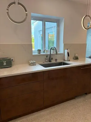 a kitchen with a sink and a window at Mid-Century with Outdoor Oasis in Fort Lauderdale