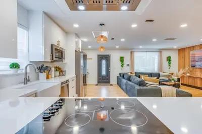 a kitchen and a living room in a house at Fox Garden Luxury Boho Near Downtown & Beach home in Fort Lauderdale