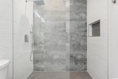 a shower with a glass door in a bathroom at Fox Sonata Downtown Pool House home in Fort Lauderdale