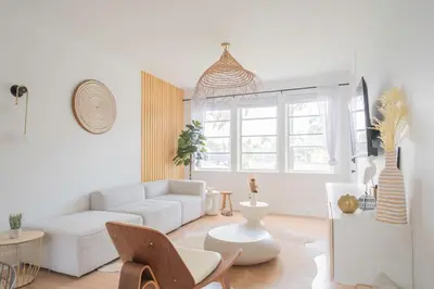 a living room with a white couch and a table at Stylish 2br apt, 5 mins to the BEACH J2 in Hollywood