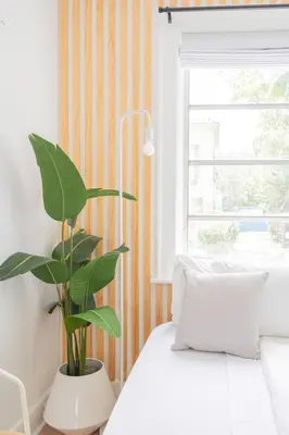 a bedroom with a white bed and a plant at Stylish 2br apt, 5 mins to the BEACH J2 in Hollywood