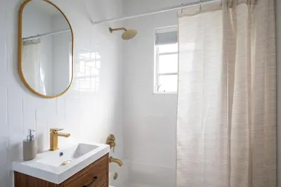 a bathroom with a sink and a shower with a mirror at Cozy 2br 5 mins drive to the beach j6 in Hollywood