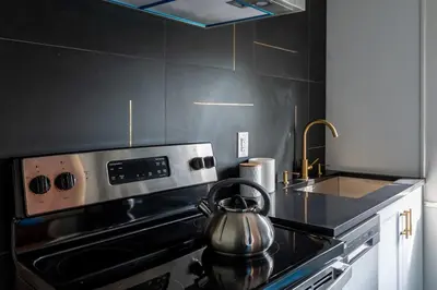 a tea kettle sitting on top of a stove in a kitchen at Cozy 2br 5 mins drive to the beach j6 in Hollywood