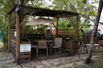 a gazebo with a table and chairs and an umbrella at Cozy 2br 5 mins drive to the beach j6 in Hollywood