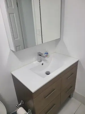 a bathroom with a sink and a mirror at Lovely condo on the Beach - Tides Hollywood 14th Floor in Hollywood