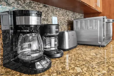 a blender sitting on a counter next to a toaster at Resort at Sunny Isles Beach with Ocean view in Sunny Isles Beach