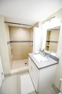 a bathroom with a sink and a shower at The Hamptons Hideaway in Hollywood