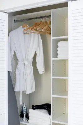 a closet filled with white clothes and towels at The Hamptons Hideaway in Hollywood