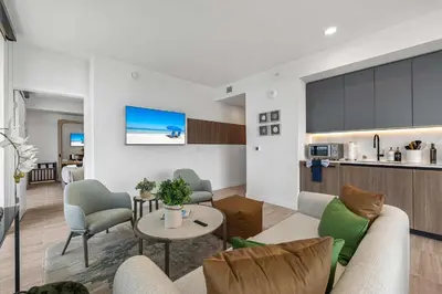 a living room with a couch and a table at Ocean Dreams Chic 2BR Getaway Minutes from Miami's Top Attractions in Miami Beach