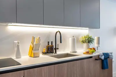 a kitchen with a sink and a counter top at Miami Beach Retreat Cozy 1BR Steps from the Shore in Miami Beach