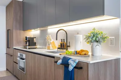 a kitchen with a sink and a counter top with a counter sidx sidx at Miami Beach Retreat Cozy 1BR Steps from the Shore in Miami Beach
