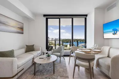 a living room with a couch and a table at Chic Miami Retreat Stylish 2BR Gem for 5 in Miami Beach