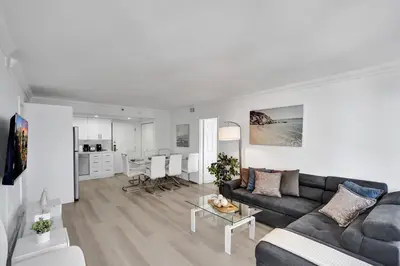 a living room with a couch and a table at Gorgeous Ocean View 3BD Condo in Beachfront Resort 907 in Miami Beach