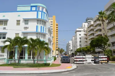 a car driving down a street next to a building at WATERFRONT STUDIO COZY WITH WATERVIEWs in Miami Beach