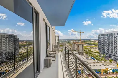 a balcony with a view of a city at Modern 1BR in Downtown Doral - Free Parking and Wellness Amenities in Miami