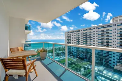 a balcony with a view of a building at Stunning Oceanfront 1BR in the 1 Hotel in Miami Beach
