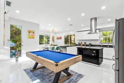 a kitchen with a pool table in the middle of it at Brand new Luxurious Villa in Hollywood