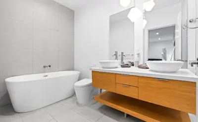 a bathroom with two sinks and a tub and a toilet at One and only New Villa Heated Pool Jacuzzi in Hollywood