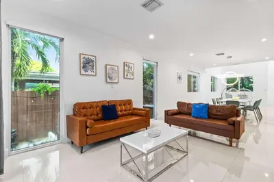 a living room with two couches and a table at One and only New Villa Heated Pool Jacuzzi in Hollywood