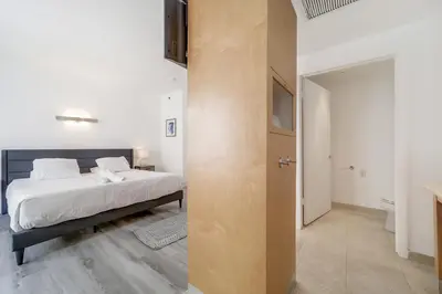 a bedroom with a bed and a bathroom at St Augustine Hotel By At Mine Hospitality in Miami Beach