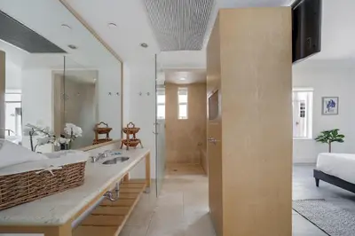 a bathroom with a sink and a mirror at St Augustine Hotel By At Mine Hospitality in Miami Beach