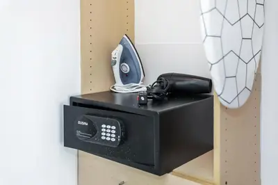 a black microwave with a phone on top of it at St Augustine Hotel By At Mine Hospitality in Miami Beach