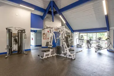 a gym with treadmills and machines in a room at Urban Escape 2 Bed Unit In Miami near Whole Foods in North Miami