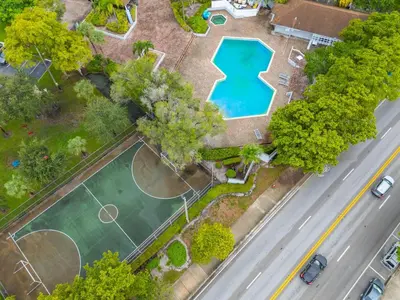 an overhead view of a tennis court and a road at Urban Escape 2 Bed Unit In Miami near Whole Foods in North Miami