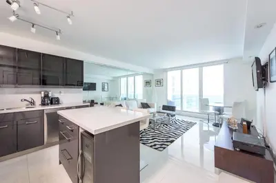 a large kitchen with a large open floor plan at Large 2 Bedroom Oceanfront at Roney Palace in South Beach in Miami Beach