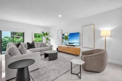 a living room with a couch and a tv at Casa Bella - New & Stylish Family-Friendly Home in Miami