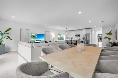 a living room with a wooden table and chairs at Casa Bella - New & Stylish Family-Friendly Home in Miami