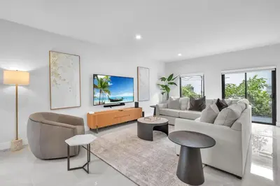 a living room with a couch and a table at Casa Amoret - Brand New Family-Friendly Retreat in Miami