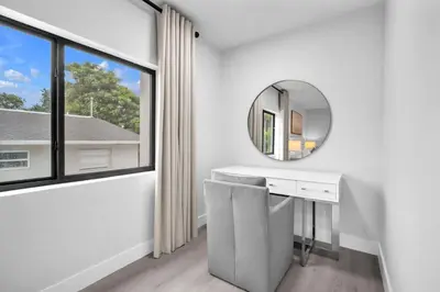 a white bathroom with a mirror and a window at Casa Amoret - Brand New Family-Friendly Retreat in Miami