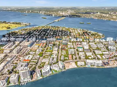 an aerial view of a city with a harbor at Waterfront Luxury Kosher Condo with Rooftop Pool, Bay Harbor Islands in Miami Beach