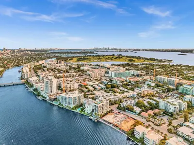 an aerial view of a city next to the water at Waterfront Luxury Kosher Condo with Rooftop Pool, Bay Harbor Islands in Miami Beach