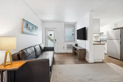 a living room with a couch and a kitchen at 713 Miami Beach Apartments in Miami Beach