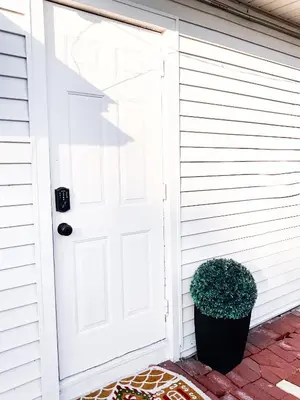 a white door on the side of a house at Lodgings by Lisa in Cooper City