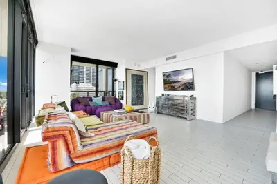 a living room with couches and chairs in a building at Stunning Oceanfront 2BR W Hotel in Miami Beach
