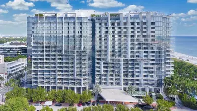 an aerial view of a large building next to the ocean at Stunning Oceanfront 2BR W Hotel in Miami Beach