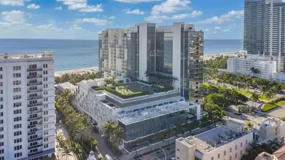 an aerial view of a city with buildings and the ocean at Stunning Oceanfront 2BR W Hotel in Miami Beach
