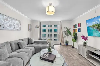 a living room with a couch and a table at Lux condo on 25floor in Brickell in Miami