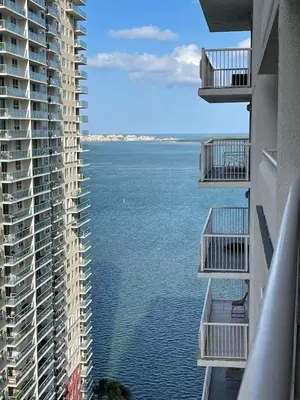 a view of the ocean from between two buildings at Lux condo on 25floor in Brickell in Miami