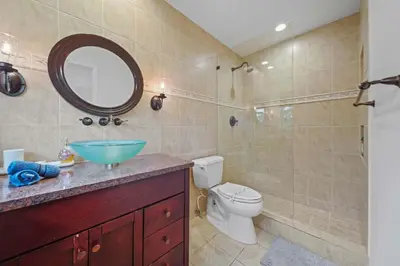 a bathroom with a sink and a toilet and a shower at Luxe Escape 2BR Fort Lauderdale in Fort Lauderdale