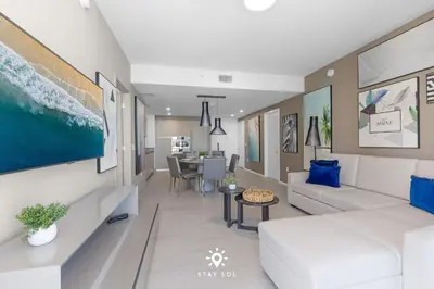 a living room with a couch and a table at Luxury 2BR Apt With Ocean View Pool & Amenities in Hollywood