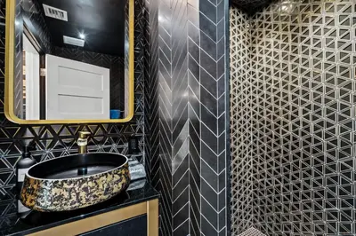 a bathroom with a sink and a mirror at Beach Pop - Steps to Beach Heated Pool & Hot Tub in Fort Lauderdale