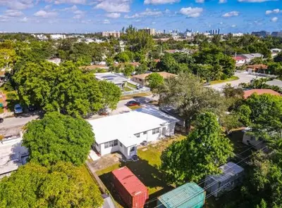 an overhead view of a city with trees and a building at Miami Luxury Home Close to Beach & Aventura Mall in Biscayne Park